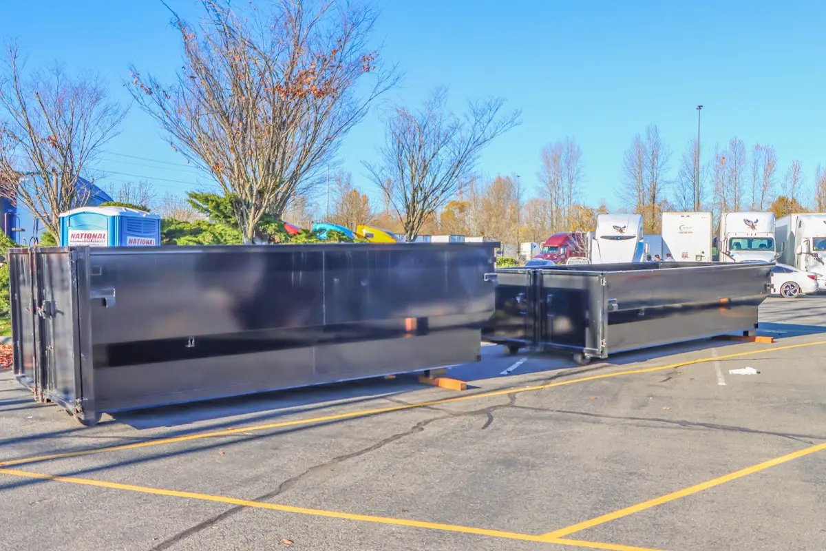 Professional dumpster rental service with roll-off container on residential driveway in Santa Clarita